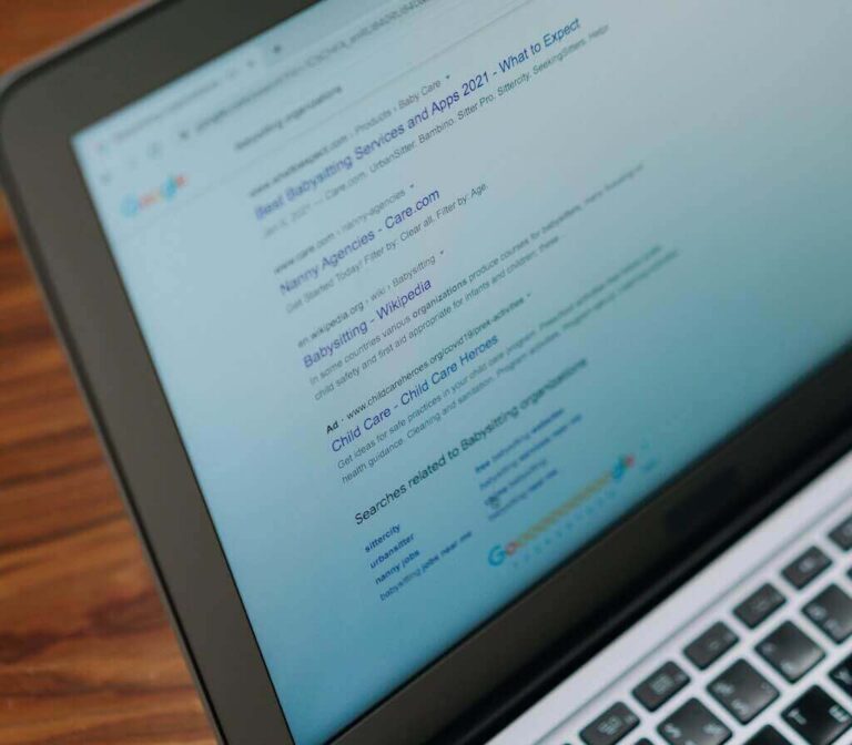 Person using Google search engine and finding relevant ads displayed on the search results page.